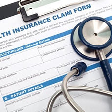 Health insurance claim form with stethoscope
