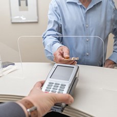 Patient using card to pay for treatment
