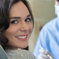 woman smiling dentist chair