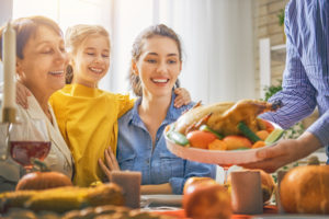 Family smiling at Thanksgiving