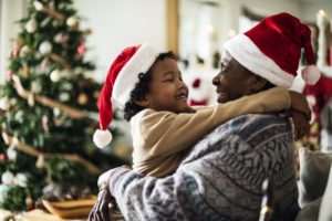 child and grandparent hugging each other