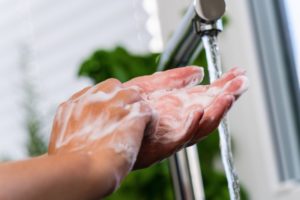 Arlington dentist washing their hands without hand jewelry in COVID-19